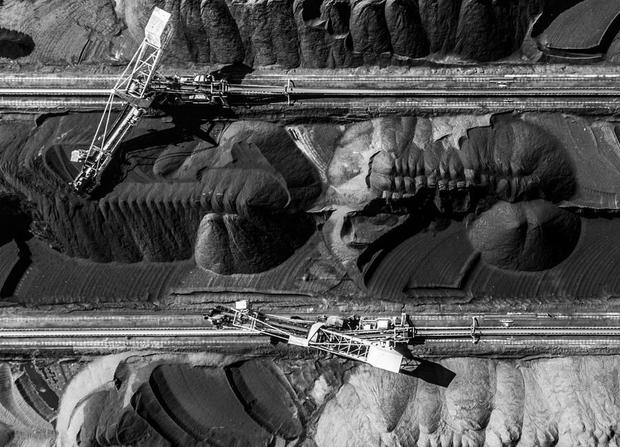Aerial view of heavy equipment at a coal mining site