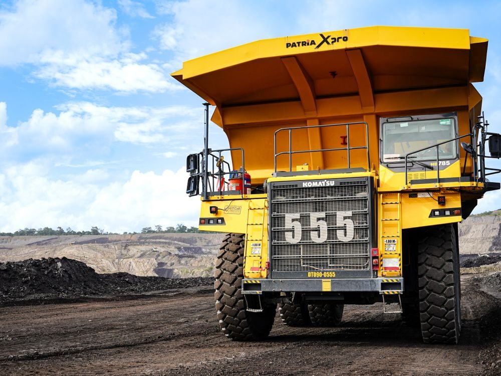 Massive mining dump truck transporting coal